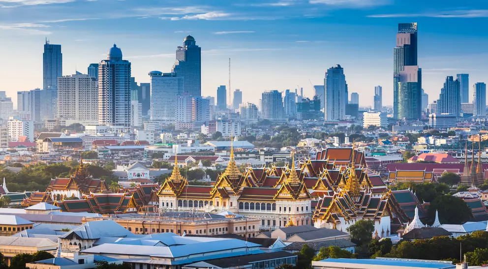 Sunrise of Bangkok tower skyline with The Grand Palace in foreground