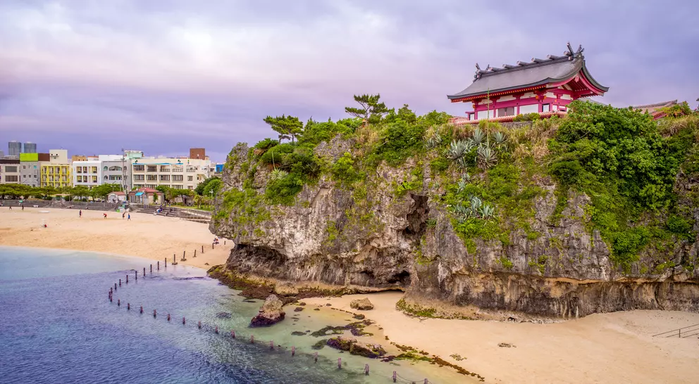 Japanese shrine on hill over breach and ocean