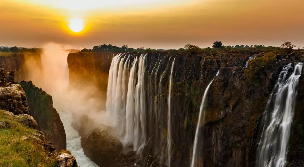 Panorama of Victoria Falls at sunset.