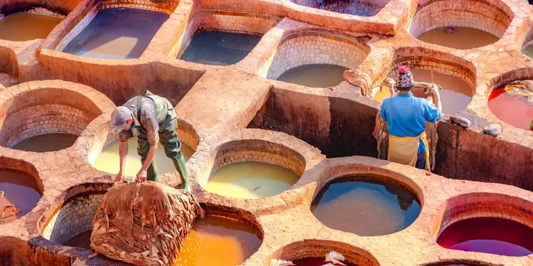 Leather dying in a traditional tannery in the city of Fez, Morocco