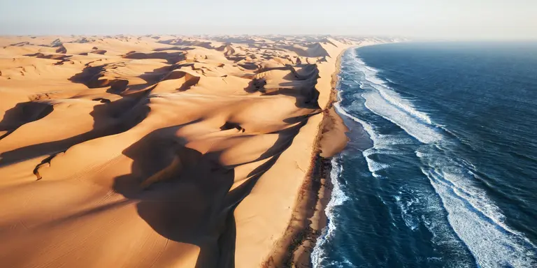 Aerial photo of where the Namib desert and the Atlantic ocean