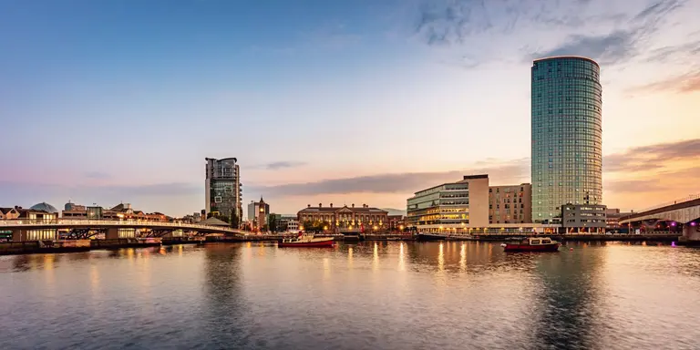 Panorama of Belfast River Lagan Waterfront Cityscape and Lagan Bridge at Sunset Twilight