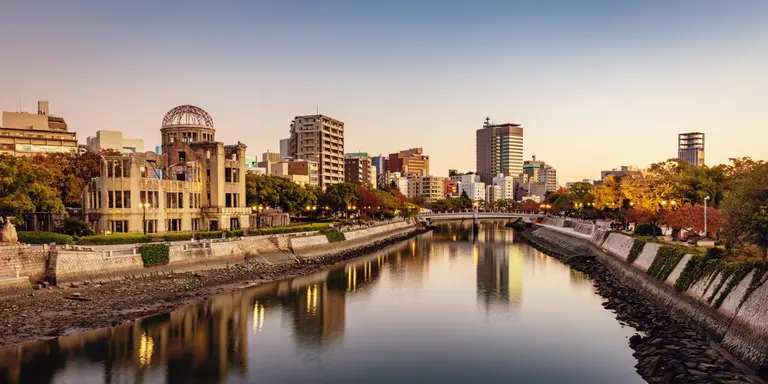 Panorama of Hiroshima Cityscape at Twilight. View over the Ota River, Atomic Bomb Dome illuminated on the left side of the river