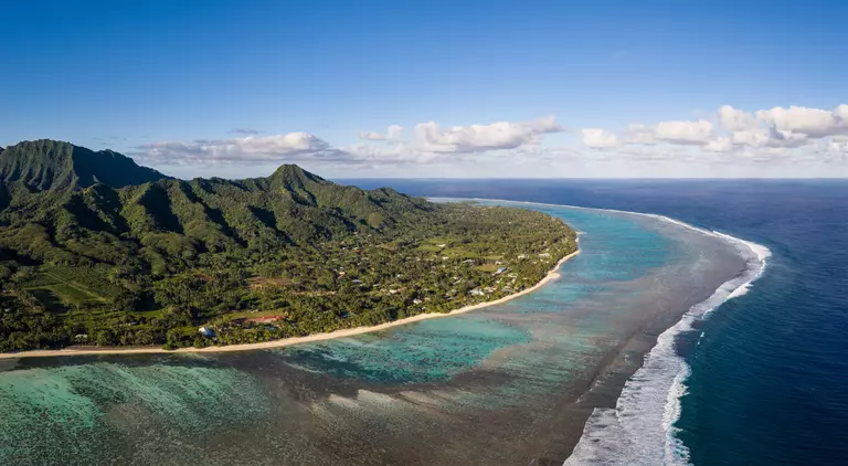 Rarotonga island, part of the Cook islands, in the Pacific ocean, with its jungle covered mountain and stunning beach