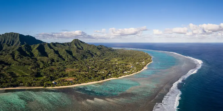 Rarotonga island, part of the Cook islands, in the Pacific ocean, with its jungle covered mountain and stunning beach