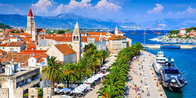 Sunny promenade along the pier of old Venetian town, Dalmatian Coast.