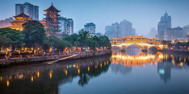 river with bridge and pagoda in background