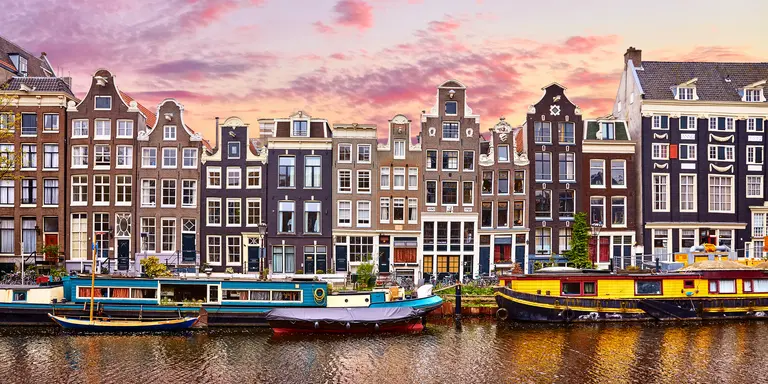 Floating Houses and houseboats and boats at channels by banks