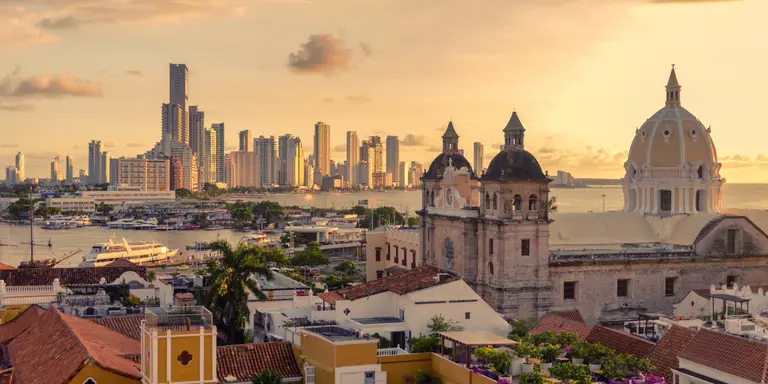 View of the historic center of Cartagena, Colombia with the Caribbean Sea and skyscrapers visible in the background