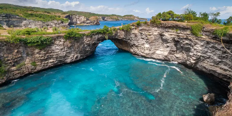 Stone arch over the sea called Broken beach on Nusa Penida ,Indonesia