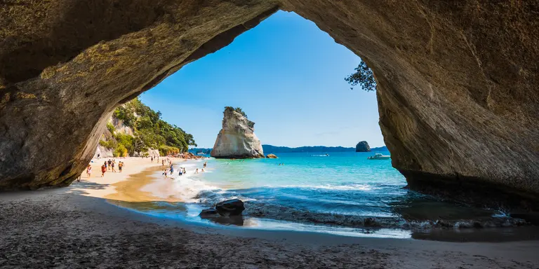 Stunning cove with view of white sand beach and blue waters on the other side