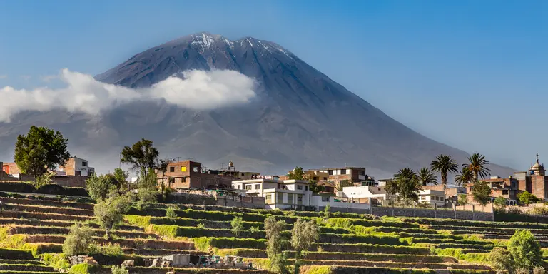 Dormant Misti Volcano over the fields and houses of peruvian city of Arequipa, Peru