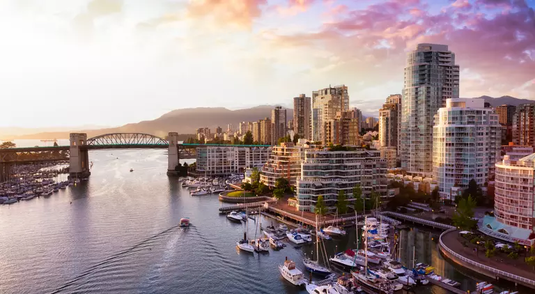 iew of Burrard Bridge and False Creek in downtown, taken during a beautiful cloudy sunset.