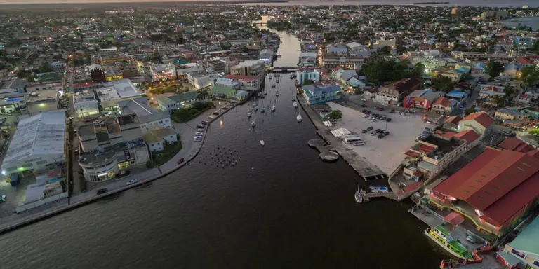 Evening sunset cityscape of Belize City with Caribbean Sea in background