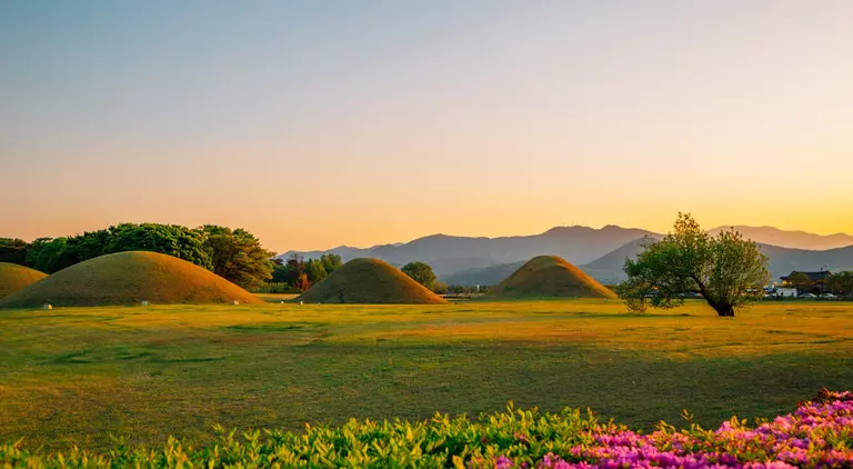 Sunset view of Gyeongju Daereungwon Tomb Complex grass mounds in Gyeongju, Korea