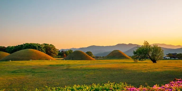 Sunset view of Gyeongju Daereungwon Tomb Complex grass mounds in Gyeongju, Korea