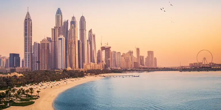 Sunset view of the Dubai Marina and tthe golden sand beaches in the Persian Gulf