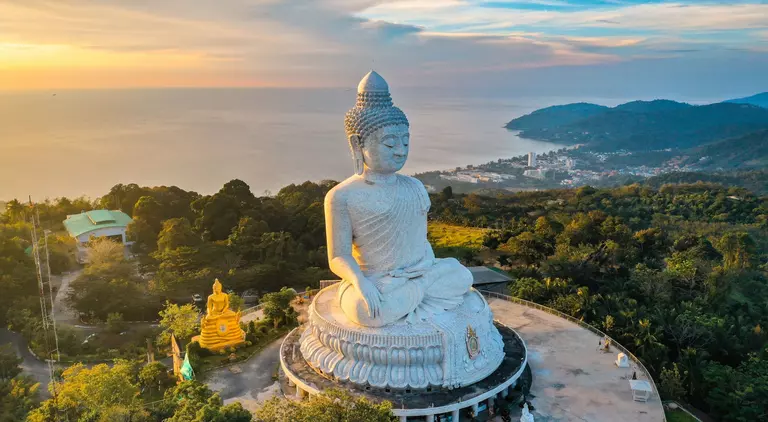 Aerial view of Big Buddha viewpoint at sunset on Phuket with a view of the water and coast below