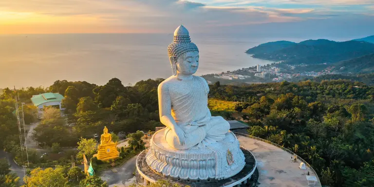 Aerial view of Big Buddha viewpoint at sunset on Phuket with a view of the water and coast below