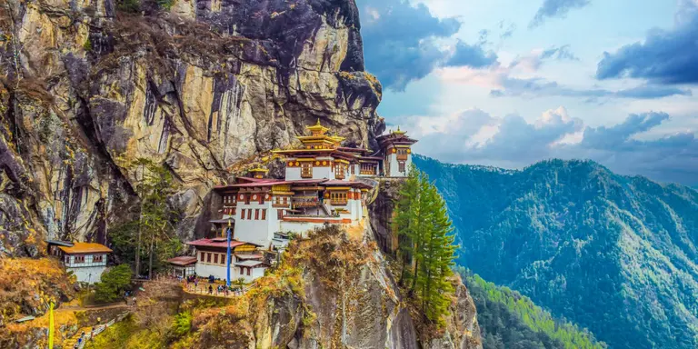 The Taktsang Palphug (Tiger’s Nest) monastery clings to cliffs 1200m above the forested Paro Valley