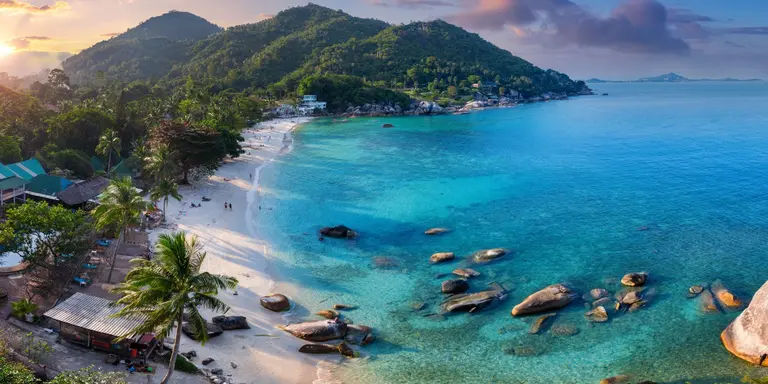 Bay and beach at sunset, stunning colours of the sky and water