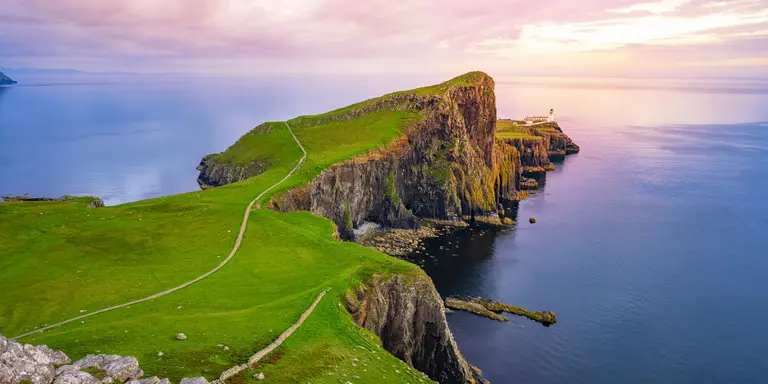 Lightouse at edge of cliff overlooking atlantic ocean