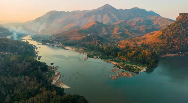 Aerial view of tranquil scene of river at sunset