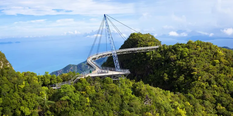 Amazing cable bridge over the tropical rainforest island landscape