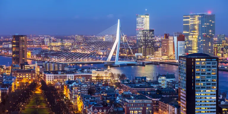 Aerial shot of Rotterdam skyline with Erasmus bridge at twilight as seen from the Euromast tower