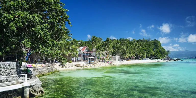Beach in tropical paradise with stunning emerald waters