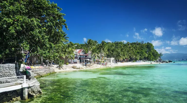 Beach in tropical paradise with stunning emerald waters