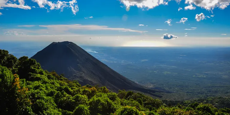 View of volcano with lush hungles and horizon