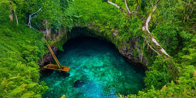 Famous swimming hole surrounded by lush forest