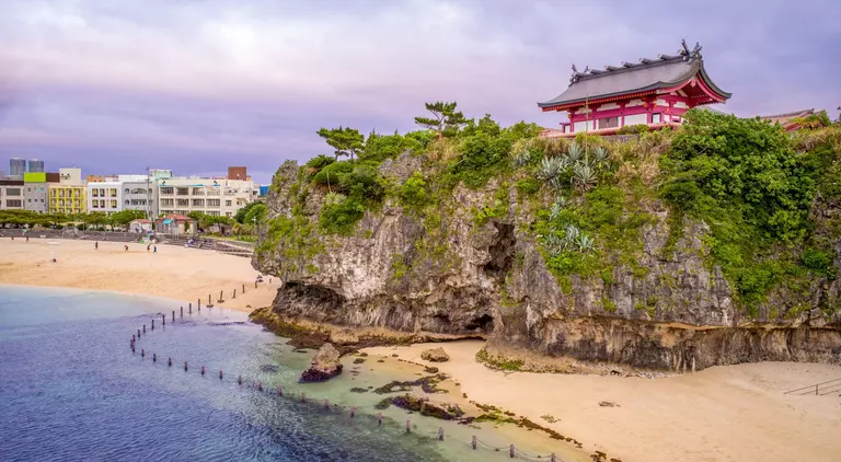 Japanese shrine on hill over breach and ocean