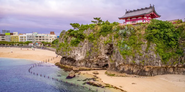 Japanese shrine on hill over breach and ocean