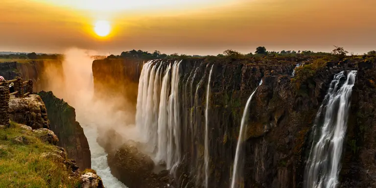 Panorama of Victoria Falls at sunset.