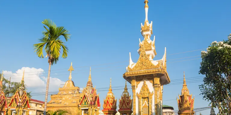 Buddhist stupas with palm trees