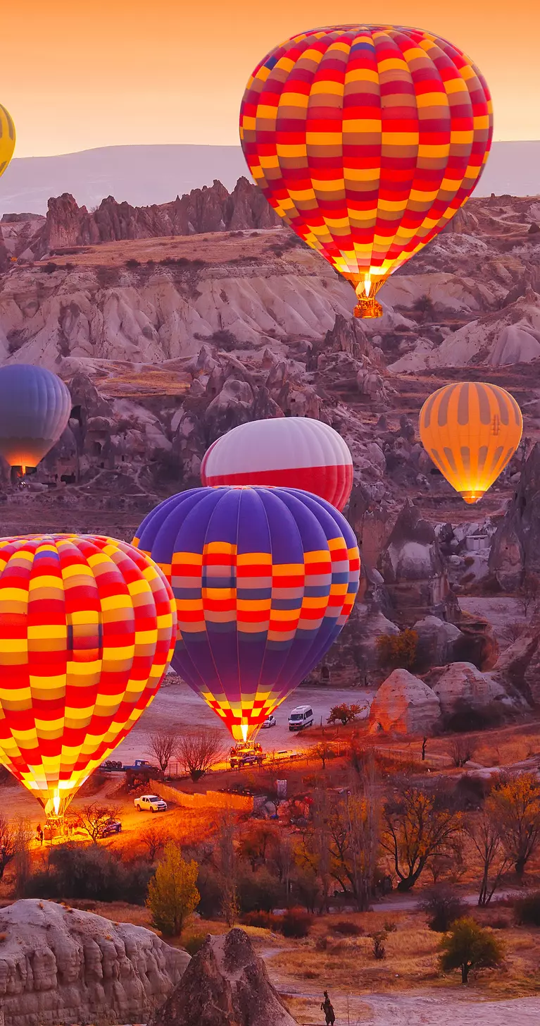 Scenic vibrant view of balloons in flight in Cappadocia Valley