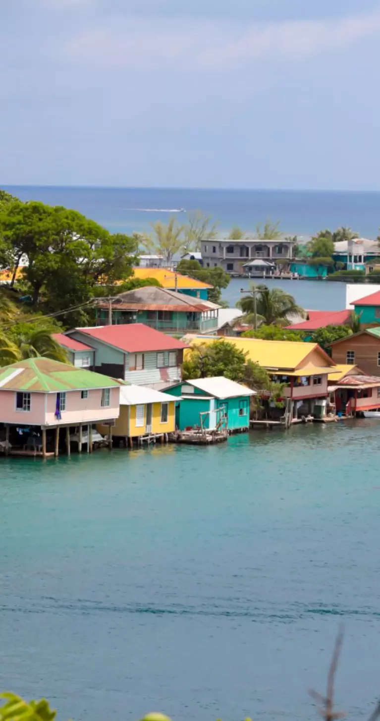 Colorful wooden stilt homes located at a seaside village on Roatain, which is part of the Bay Islands of Hondouras