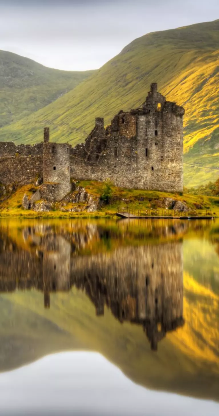 Reflections in Loch Awe at sunset of Kilchurn Castle, Scotland