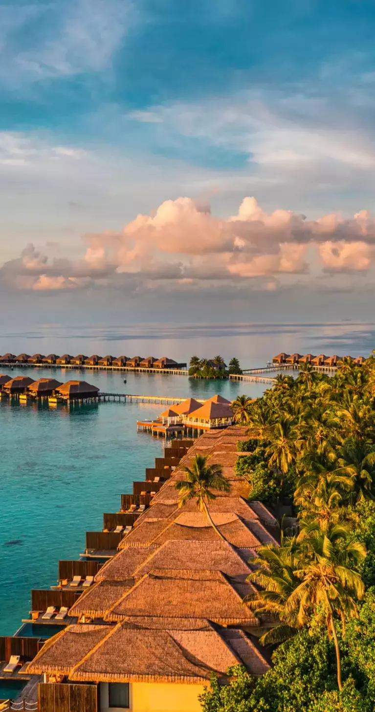 Aerial view of bungalows over the ocean in the Maldives