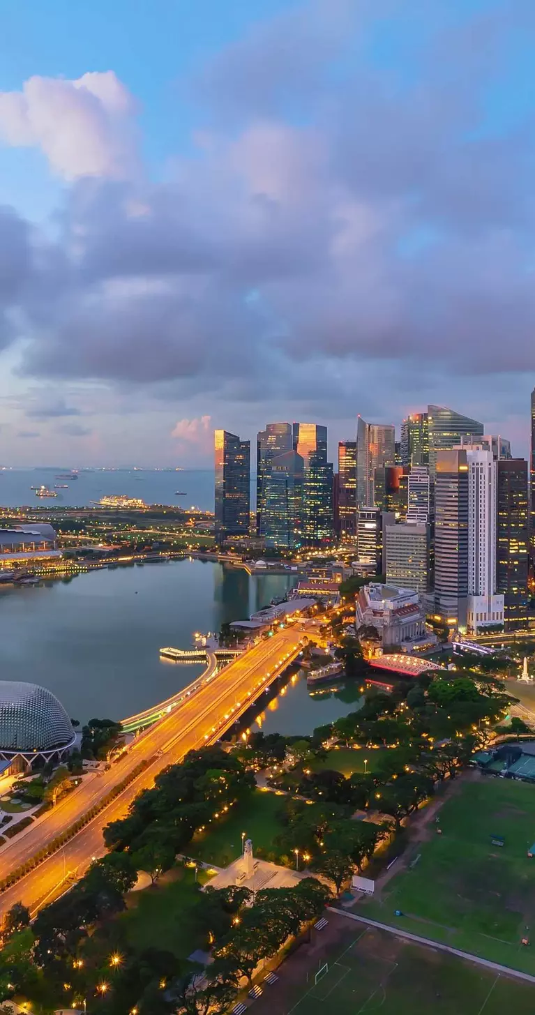 Singapore landmark city skyline, with iconic three tower Marina Bay Sands, during sunrise