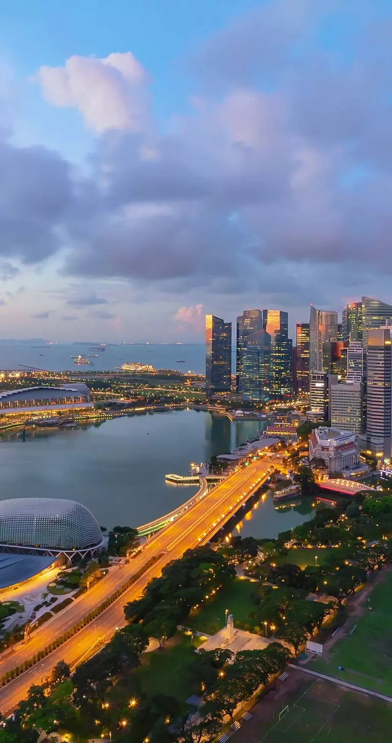 Singapore landmark city skyline, with iconic three tower Marina Bay Sands, during sunrise