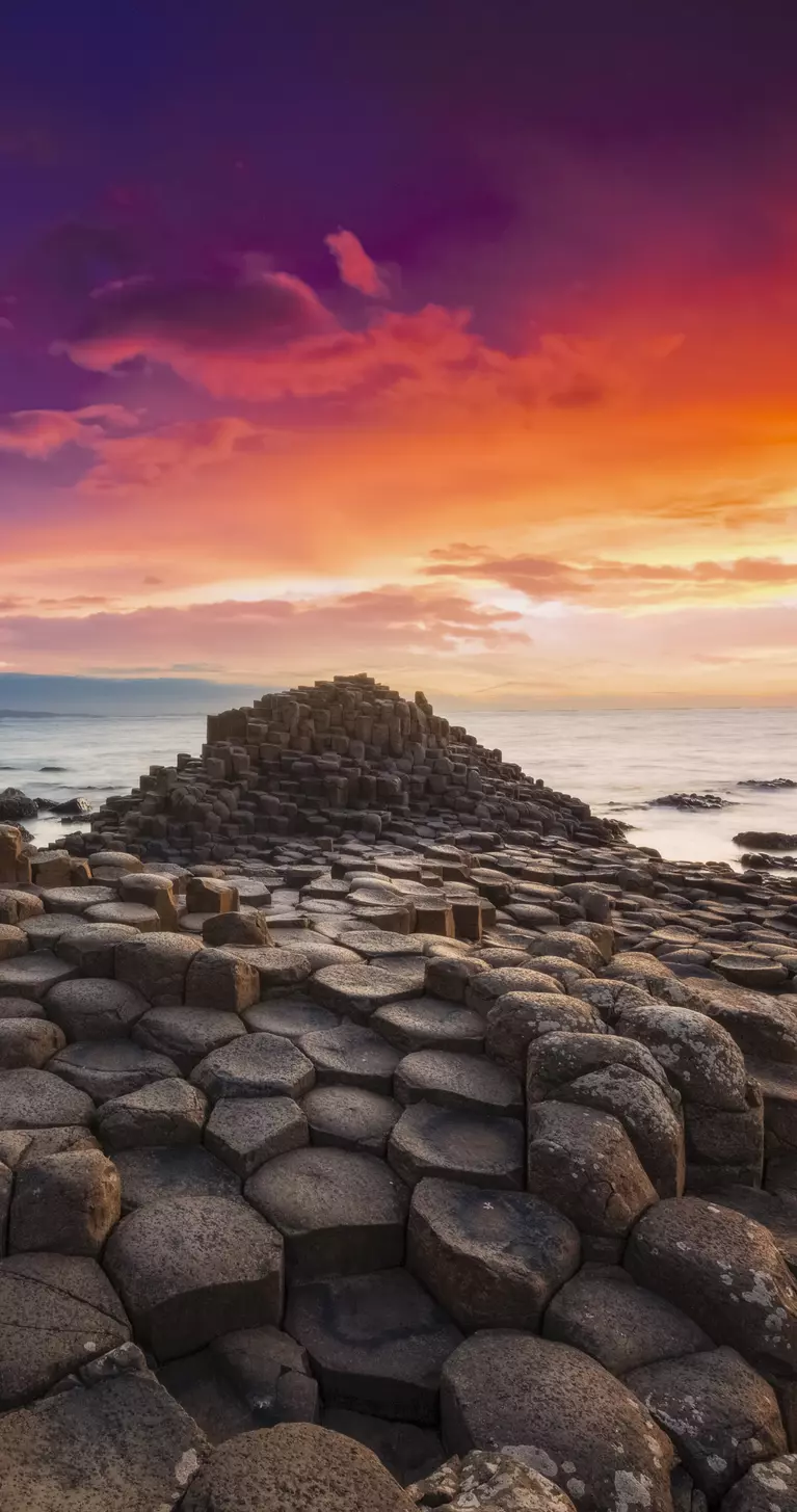Colourful sunset at the Giant's Causeway Northern Ireland