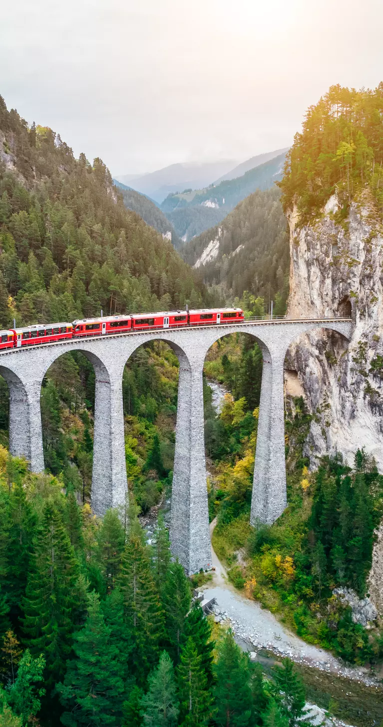 Train crossing Landwasser Viaduct on raethian railway in Filisur – Albula, Graubunden, Switzerland