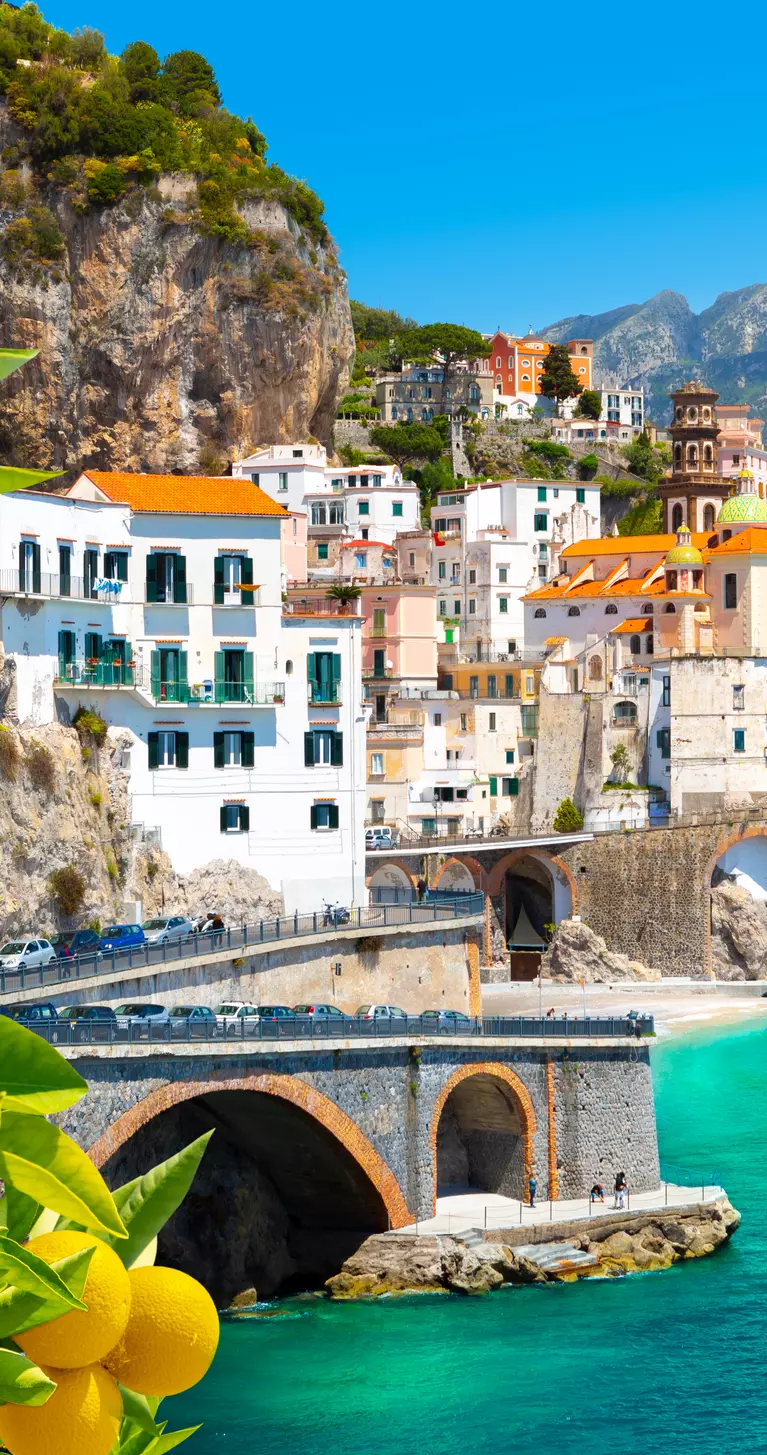 Beautiful view of Amalfi on the Mediterranean coast with lemons in the foreground