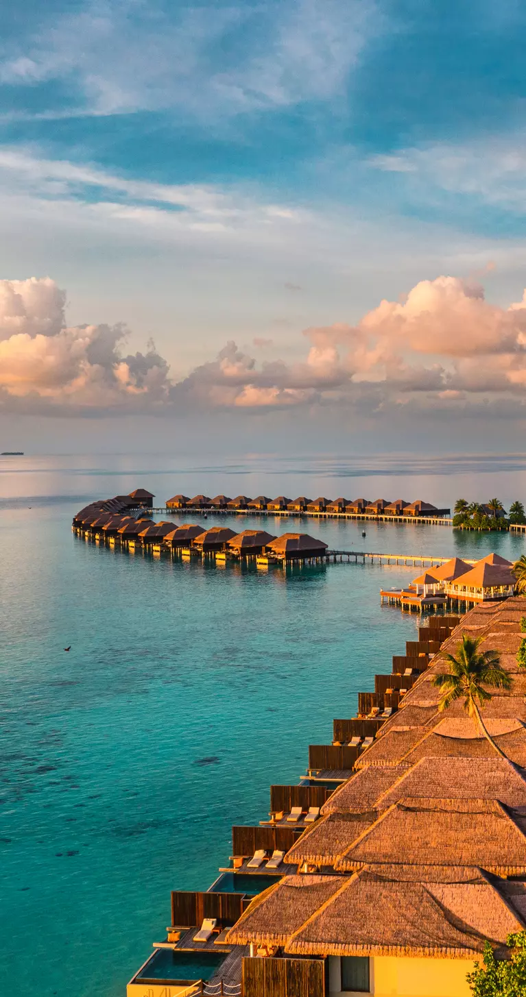 Aerial view of bungalows over the ocean in the Maldives