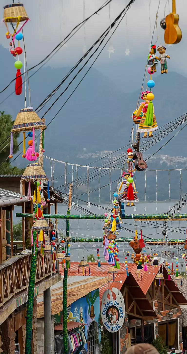 Hanging umbrellas in the colorful streets of San Juan La Laguna at Lake Atitlan, Guatemala
