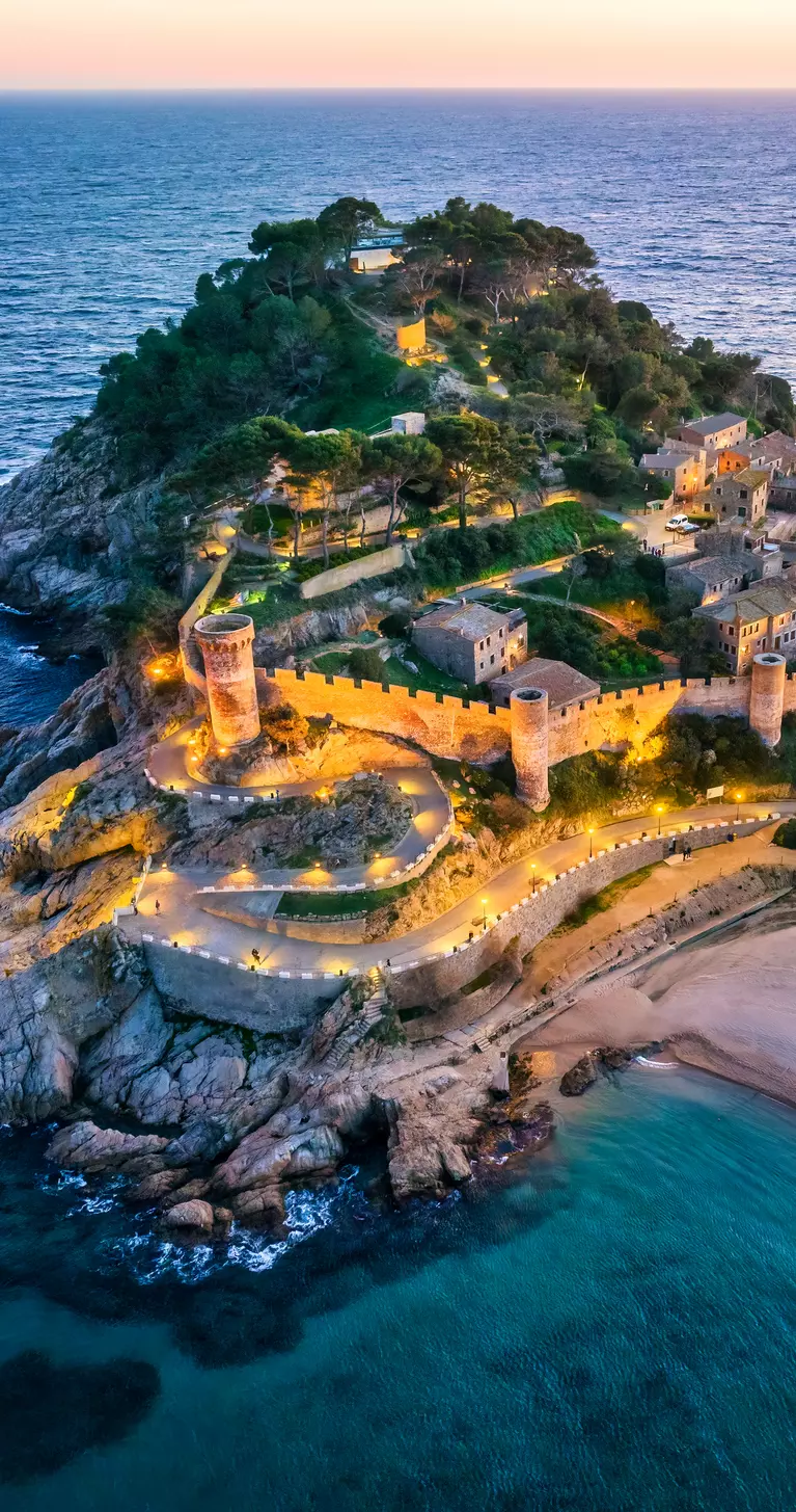 Aerial view of walls of Tossa de Mar in Costa Brava, Catalonia,at sunset, Spain