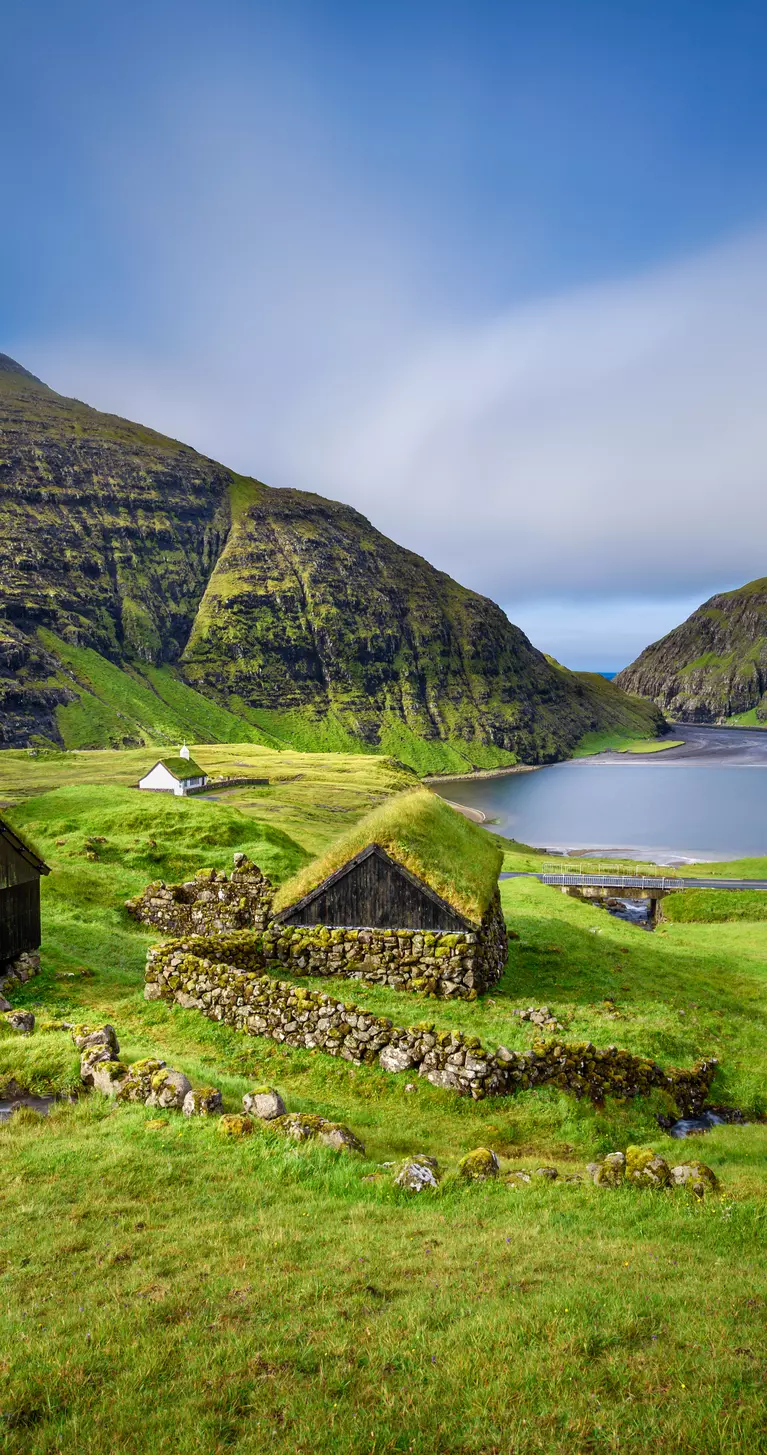 Colorful green landscape of the Village of Saksun located on the island of Streymoy, Faroe Islands